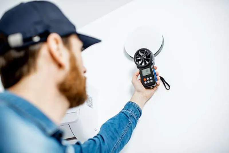 Energy auditor using a diagnostic instrument in a home